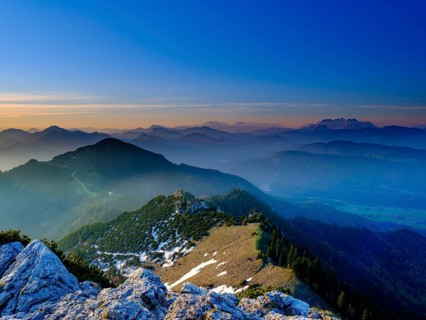 View from the Kampenwand to the Chiemgau and Berchtesgaden Alps at sunrise