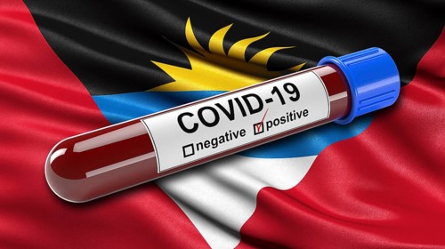 Flag of French Polynesia waving in the wind with a positive Covid-19 blood tube