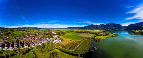 Aerial view of Schlehdorf Monastery with St. Tertulin Parish Church at Lake Lake Kochel