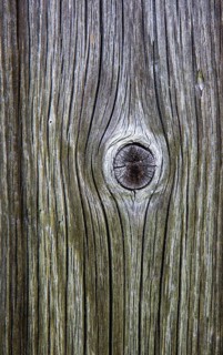 Weathered wood with knothole at a mountain hut