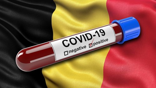 Flag of Belgium waving in the wind with a positive Covid-19 blood tube