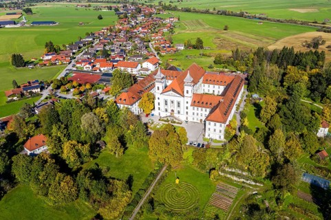 Aerial view of Schlehdorf Monastery with St. Tertulin Parish Church at Lake Lake Kochel