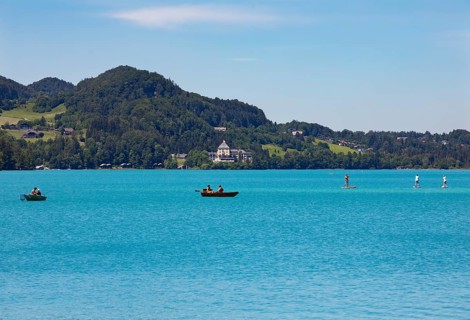 Boats at the Fuschlsee with castle Fuschl