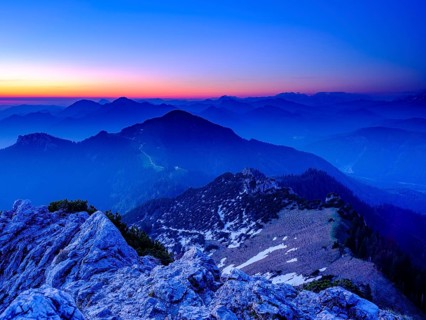View from the Kampenwand to the Chiemgau and Berchtesgaden Alps at dawn