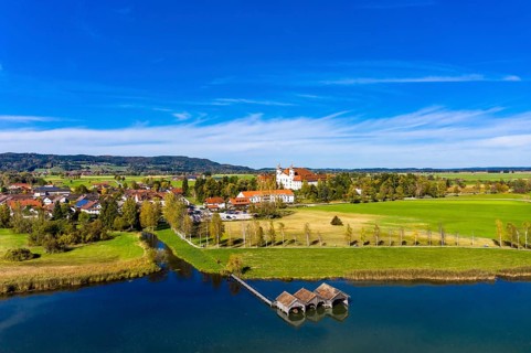 Aerial view of Schlehdorf Monastery with St. Tertulin Parish Church at Lake Lake Kochel