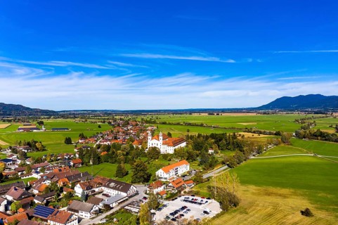 Aerial view of Schlehdorf Monastery with St. Tertulin Parish Church at Lake Lake Kochel