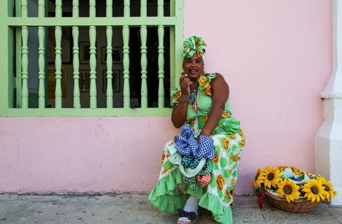Some women in Habana Vieja wear beautifully coloured dresses and for some money readily pose for photographs