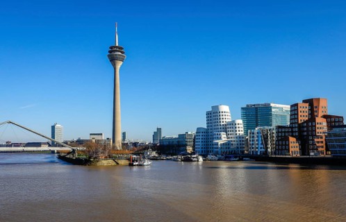 City panorama at the Media Harbour with Gehry buildings at the new Zollhof and Rhine Tower