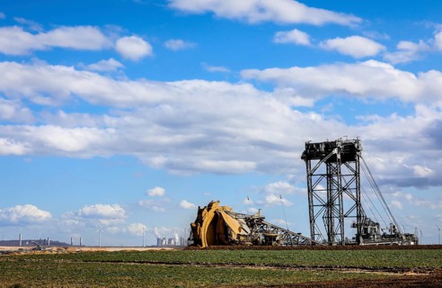 Bucket-wheel excavator wheel excavator in the RWE opencast lignite mine Garzweiler excavates at the demolition edge near Keyenberg