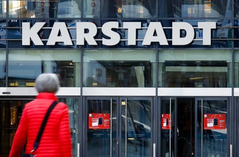 Passers-by in front of the entrance of the Galeria Karstadt Kaufhof store in the Limbecker Platz shopping centre