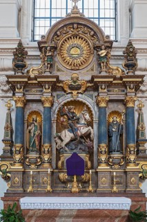 Side altar with figures of saints and the dragon slayer St. Michael