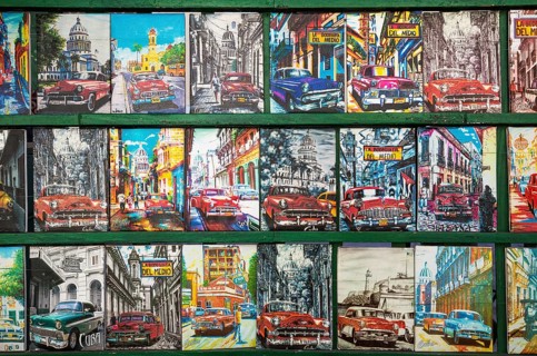 Retro style tin plaques of US classic cars at a souvenir stall
