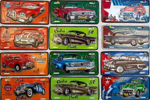 Retro style tin plaques of US classic cars in a souvenir shop