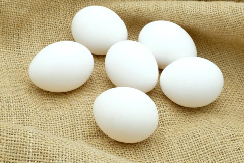 Half a dozen white free-rabge eggs on hessian