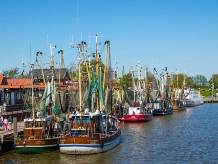 Colourful crab cutters in the fishing cutter harbour of Greetsiel