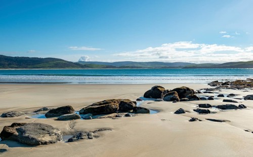 Stones on sandy beach
