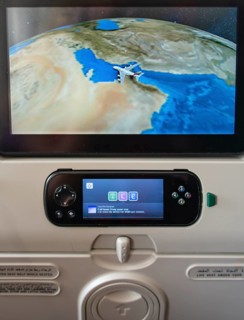 Screen showing flight position Dubai on backrest in aircraft