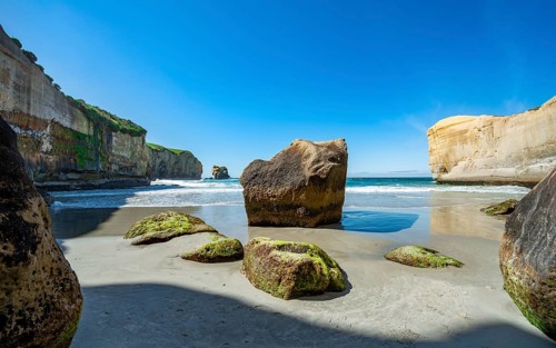 Sand beach with sandstone cliffs