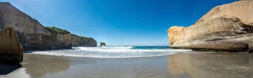 Sand beach with sandstone cliffs