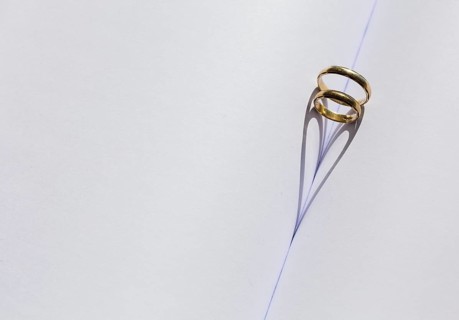 Two rings in the fold of an empty book
