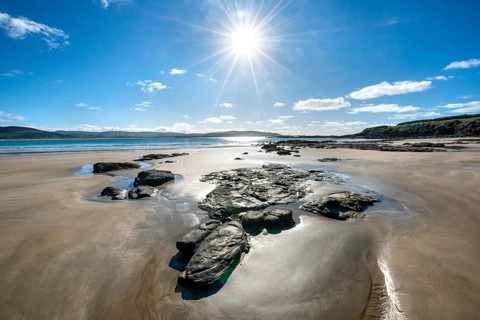 Stones on sandy beach