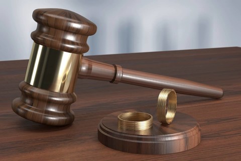 Judge's hammer with two wedding rings