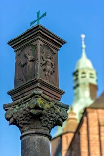 Wayside shrine in front of the neo-gothic collegiate church of St. John the Baptist