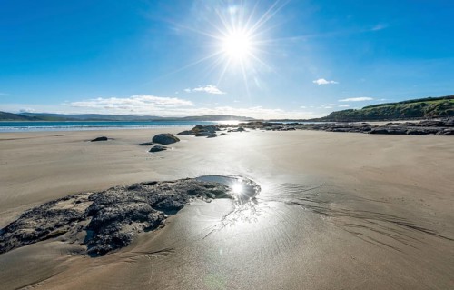 Stones on sandy beach