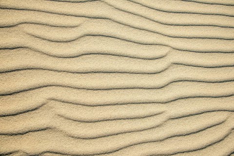 Wave patterns in light sand