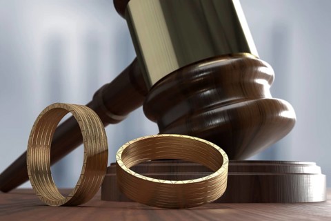 Judge's hammer with two wedding rings
