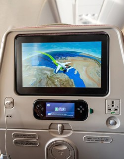 Screen showing flight position Dubai on backrest in aircraft