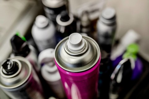 Cans with hairspray in hairdressing salon