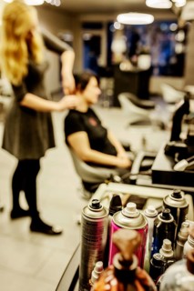 Cans of hairspray in a hairdressing salon