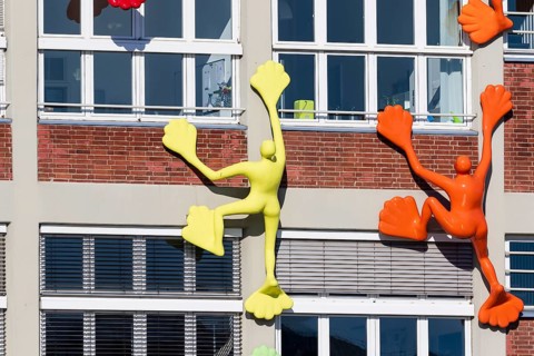 Flossi sculptures on house wall