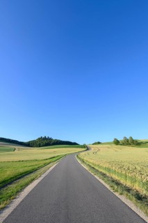 Country road leads through volcanic landscape Hegau