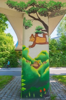 Graffiti under bridge with monkey and banana