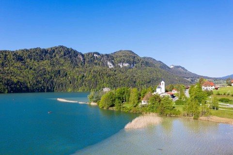Weissensee with church St. Walburga in the village Weissensee