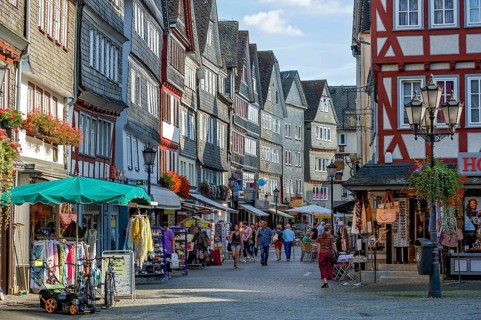 Shopping street with historic half-timbered houses