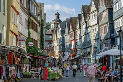 Shopping street with historic half-timbered houses