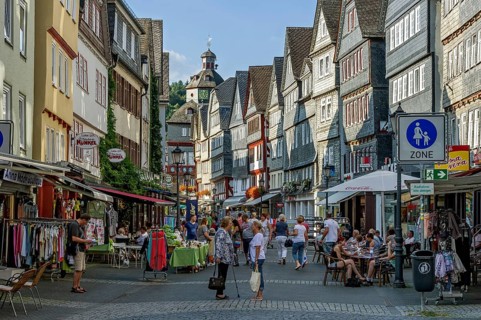 Shopping street with historic half-timbered houses