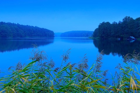 Blue hour at the lake Schmaler Luzin with boathouse