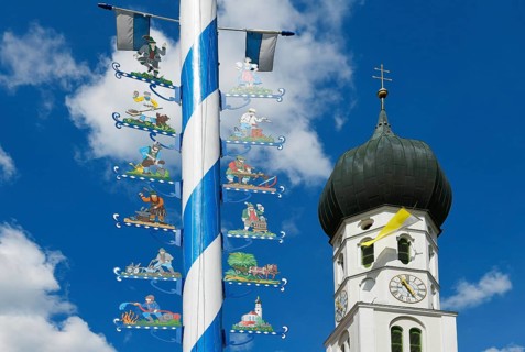 Maypole and church St. Benedikt