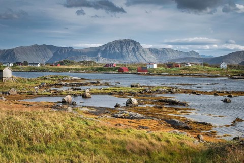 Wooden houses on a fjord at low tide