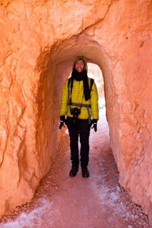 Young man in winter clothes with camera