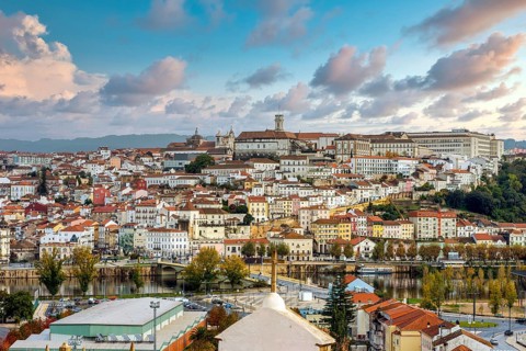 Coimbra cityscape with Mondego river by sunset