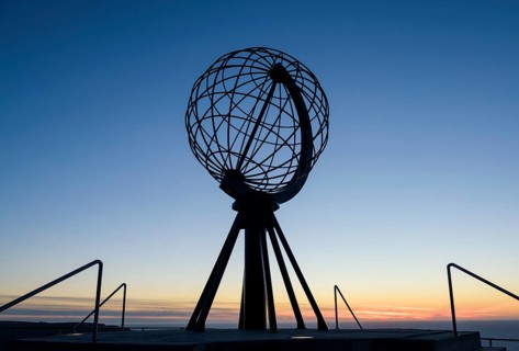 Steel globe on the North Cape after sunset
