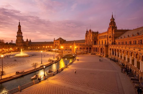 View over the illuminated Plaza de Espana at dusk Panorama
