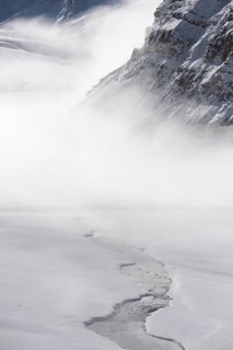 River flowing through snow covered mountains in Spiti