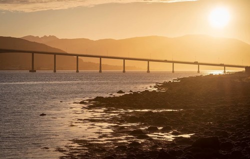 Bridge over the Gimsoy Straumen highway E6 at sunset