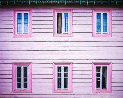 Pink wooden facade with windows